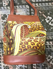 Vintage Salvatore Ferragamo leopard in safari jungle print brown leather hobo shoulder bag with golden gancini motif. Must have.
