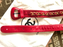 Vintage CHANEL red leather belt bag, fanny pack with detachable chain belt and CC stitch mark on flap. Fits 29.5" through 32.8"