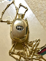 Vintage Gucci golden perfume bottle necklace with logo mark on top. Gorgeous rare masterpiece from 80's. 0410271