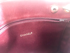 Vintage CHANEL wine leather tote bag with gold chain handles and CC motif charm. Classic purse.