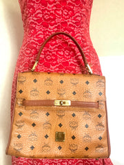 Vintage MCM classic brown monogram Kelly bag with golden logo plate. Perfect daily use bag.  By Michael Cromber, Germany