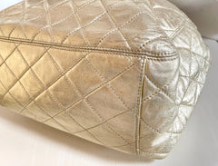 Vintage CHANEL campaign gold lamb leather hobo bucket bag with marble hoop handles and turn lock CC. 0412081