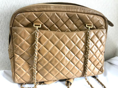 80's Vintage CHANEL brown lambskin large classic bag with double golden chain strap and a CC pull charm.