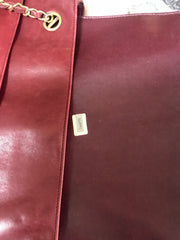 Vintage CHANEL wine leather tote bag with gold chain handles and CC motif charm. Classic purse.