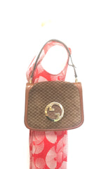 Vintage Gucci brown leather micro GG print shoulder bag with iconic golden large round GG motif. Rare masterpiece purse.