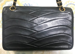 80's vintage Chanel black 2.55 shoulder bag with wavy stitches and rope strings and gold chain strap. Very rare piece from the era