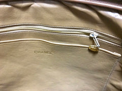 80's Vintage CHANEL brown lambskin large classic bag with double golden chain strap and a CC pull charm.