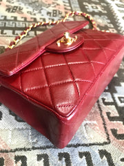 Vintage CHANEL deep red lambskin mini 2.55 bag with golden CC and chain strap. Classic Chanel red bag back in the era.