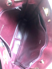 Vintage CHANEL wine leather tote bag with gold chain handles and CC motif charm. Classic purse.