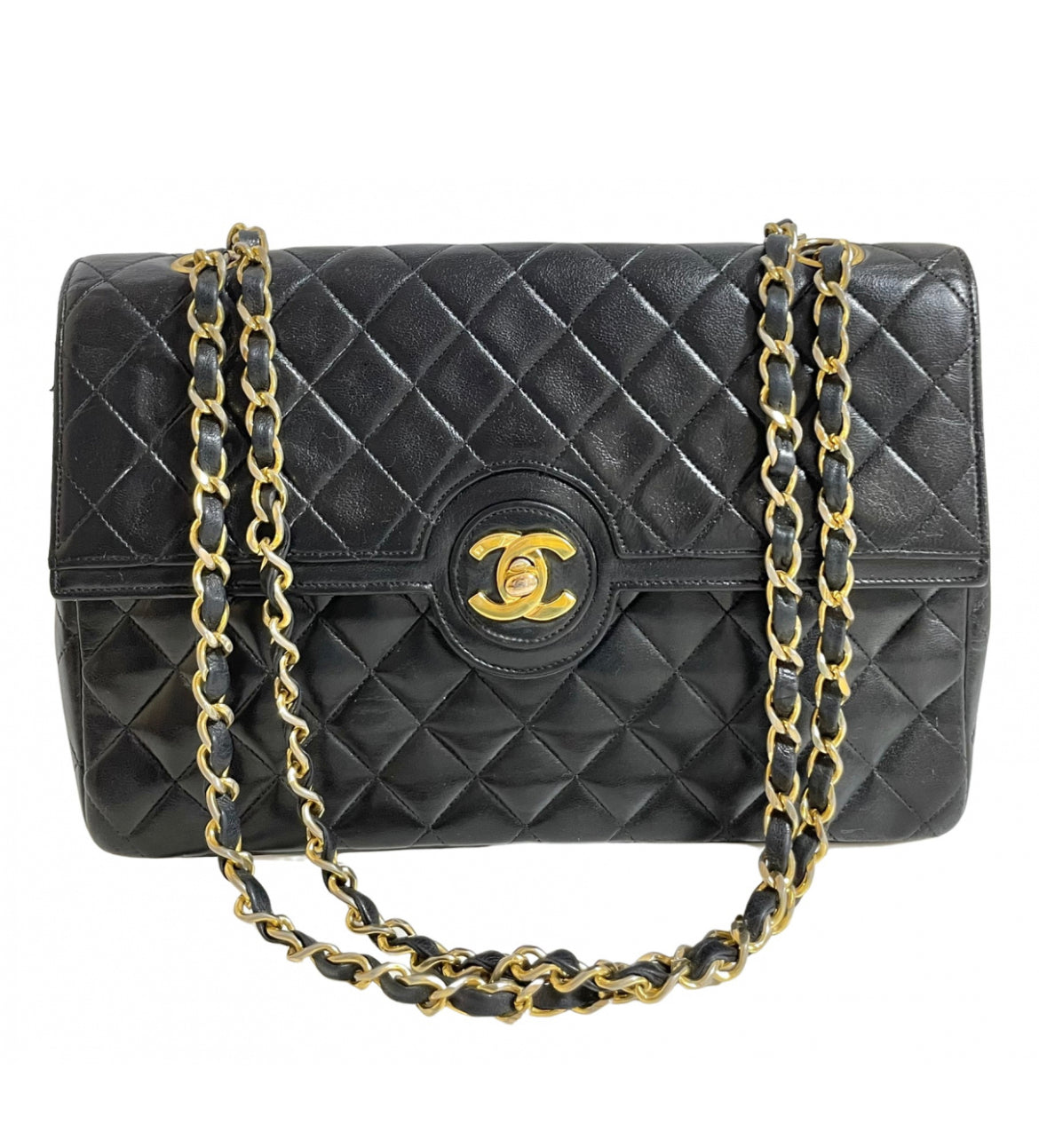80's vintage Chanel black 2.55 shoulder bag with circle CC flap design. Rare piece from the era. 0410283