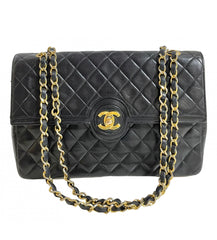 80's vintage Chanel black 2.55 shoulder bag with circle CC flap design. Rare piece from the era. 0410283
