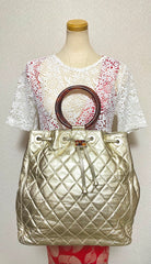 Vintage CHANEL campaign gold lamb leather hobo bucket bag with marble hoop handles and turn lock CC. 0412081