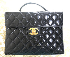 1990s. Vintage CHANEL black patent enamel briefcase business bag with golden large CC motif. Classic and traditional masterpiece you must have.