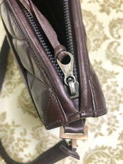 80's vintage Chanel dark brown quilted lambskin shoulder bag with CC motif and built-in chain shoulder strap. Rare Chanel purse