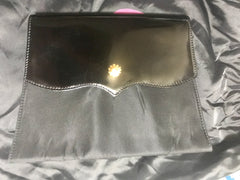 Vintage Christian Lacroix black patent enamel and nylon combo clutch bag with a sun flower shape logo motif.