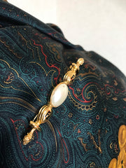 Vintage FENDI gold tone hat pin with white oval faux pearl and FF mark. Can be used as a brooch pin, jacket brooch pin too. 060926re5