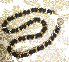 1980s Vintage CHANEL black leather thick chain belt with golden CC and mademoiselle charm. Nice and heavy single layer belt from CHANEL.