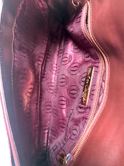 Vintage Cartier wine leather clutch bag with gold tone logo motif. Classic purse from must de Cartier Collection. 060926re8