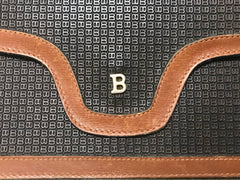 Vintage Bally black and brown wallet with B logo motif. Classic purse for unisex use.