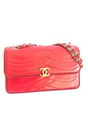 Vintage Chanel red 2.55 shoulder bag with wavy stitches and rope strings and gold chain strap. Very rare piece from the era. 050316r4