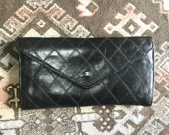 1980s. Vintage CHANEL black goatskin bill, card, checkbook long wallet pouch purse with mini CC motif. Classic unisex style.