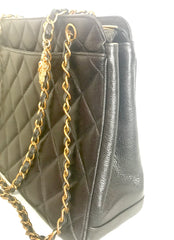 Vintage CHANEL black caviar matelasse chain shoulder bag with golden sun flower CC mark charm. Classic daily use bag.050315r5