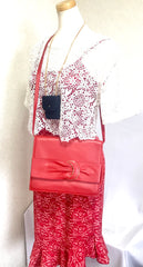 Vintage Valentino Garavani orange red leather clutch shoulder bag with a large gathered buckle design flap and V motif. Must have.