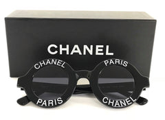 Vintage CHANEL black round frame mod sunglasses with white CHANEL PARIS logo. 060412