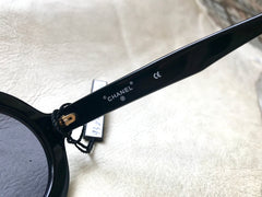 Vintage CHANEL black round frame mod sunglasses with white CHANEL PARIS logo. 060412