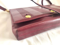 Vintage FENDI wine leather shoulder bag, large clutch purse with iconic Janus medallion embossed motifs at front. Unisex. 060620re5
