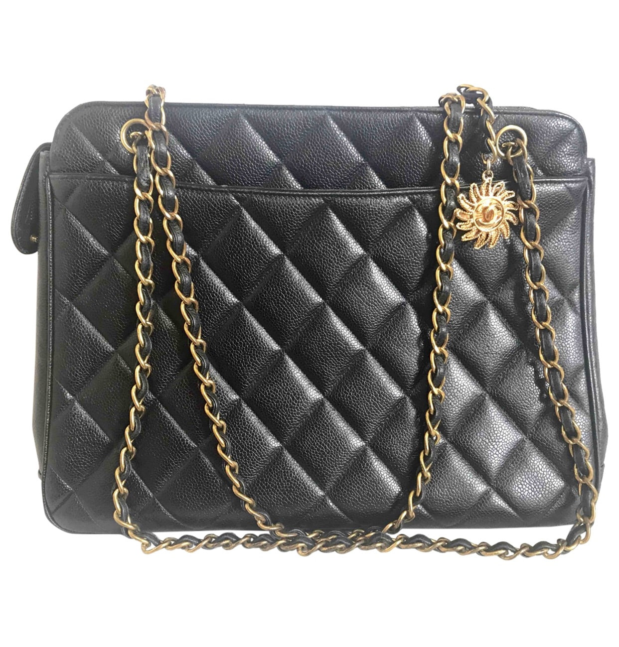 Vintage CHANEL black caviar matelasse chain shoulder bag with golden sun flower CC mark charm. Classic daily use bag.050315r5
