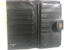 Vintage CHANEL black caviar leather wallet with stitches and gold tone CC motif. Perfect gift.