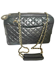 Vintage CHANEL black lamb leather large classic bag with double golden chain strap and a CC pull charm. Perfect daily bag.