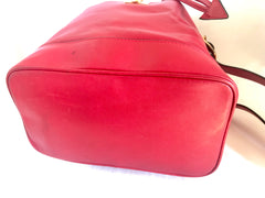 Vintage Celine red leather hobo bucket shoulder bag with a golden square logo motif and matching pouch. Classic drawstrings purse.