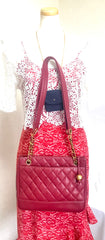 Vintage CHANEL cherry red caviar leather quilted shoulder bag, tote with golden CC ball and chain straps. Classic bag.