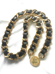 Vintage CHANEL black leather thick chain belt with golden mademoiselle and CC charm. Nice and heavy single layer belt.