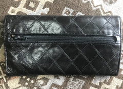 1980s. Vintage CHANEL black goatskin bill, card, checkbook long wallet pouch purse with mini CC motif. Classic unisex style.