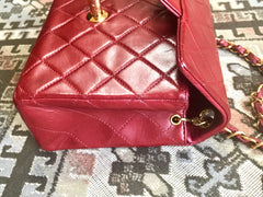 Vintage CHANEL deep red lambskin mini 2.55 bag with golden CC and chain strap. Classic Chanel red bag back in the era.