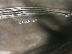 80's vintage Chanel dark brown quilted lambskin shoulder bag with CC motif and built-in chain shoulder strap. Rare Chanel purse