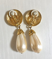 Vintage Givenchy golden round dangle earrings with teardrop faux pearl. Classic and beautiful jewelry piece.