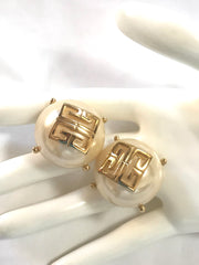 Vintage Givenchy extra large round pearl earrings with logo mark. Gorgeous jewelry piece.
