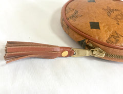 Vintage MCM brown monogram round shape coin case with tassel. Mini purse wallet. Unisex use. Made in Germany.