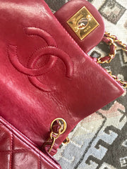 Vintage CHANEL deep red lambskin mini 2.55 bag with golden CC and chain strap. Classic Chanel red bag back in the era.