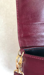 Vintage FENDI wine leather shoulder bag, large clutch purse with iconic Janus medallion embossed motifs at front. Unisex.
