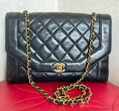 Vintage Chanel black lambskin chain 2.55 shoulder bag with gold chain. Unique hexagon shaped flap. 0407012