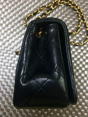 Vintage CHANEL black lambskin mini shoulder bag, classic 2.55 purse with gold tone CC closure.