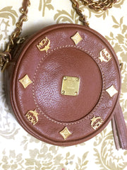 Vintage MCM brown leather round mini Suzy Wong shoulder bag with golden logo motifs. trimmings. Designed by Michael Cromer.