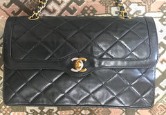 OFV 20210526 Vintage Chanel black lamb 2.55 double flap chain shoulder bag with gold and silver CC motif. Paris limited edition. Mid to large size