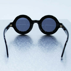 Vintage CHANEL black round frame mod sunglasses with white CHANEL PARIS logo. 060412