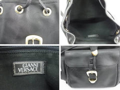 Vintage Gianni Versace black leather backpack with a big embossed medusa with gold tone hardware. Unisex bag for daily use.